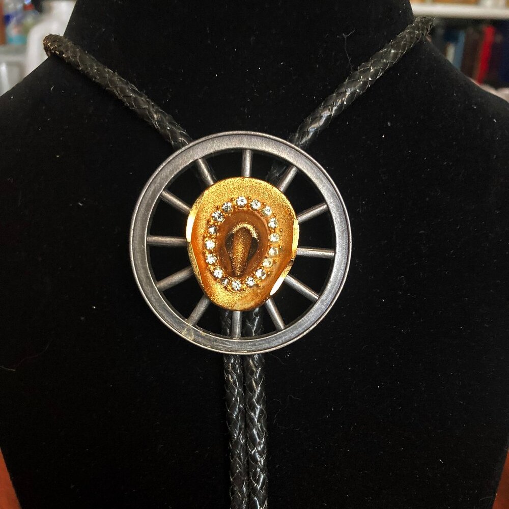 Vintage black leather enamel gold tone cowboy hat On Metal Wheel bolo tie -Rodeo